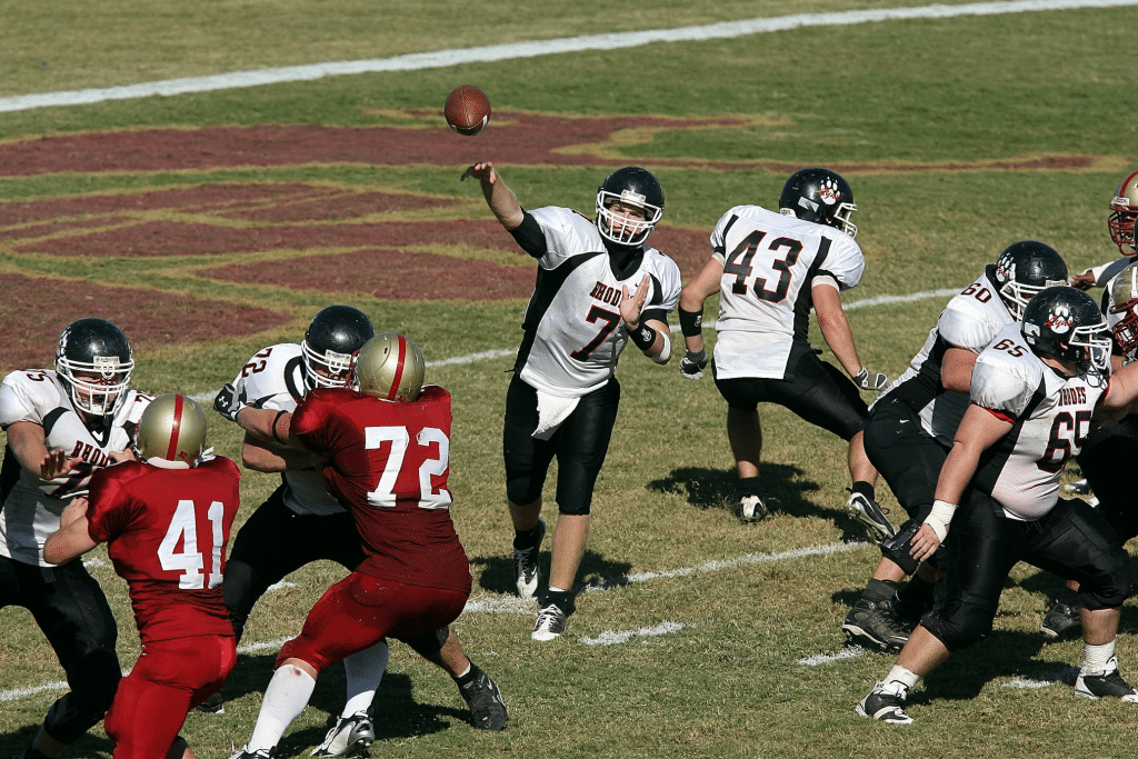 A quarterback quickly identifying an open receiver